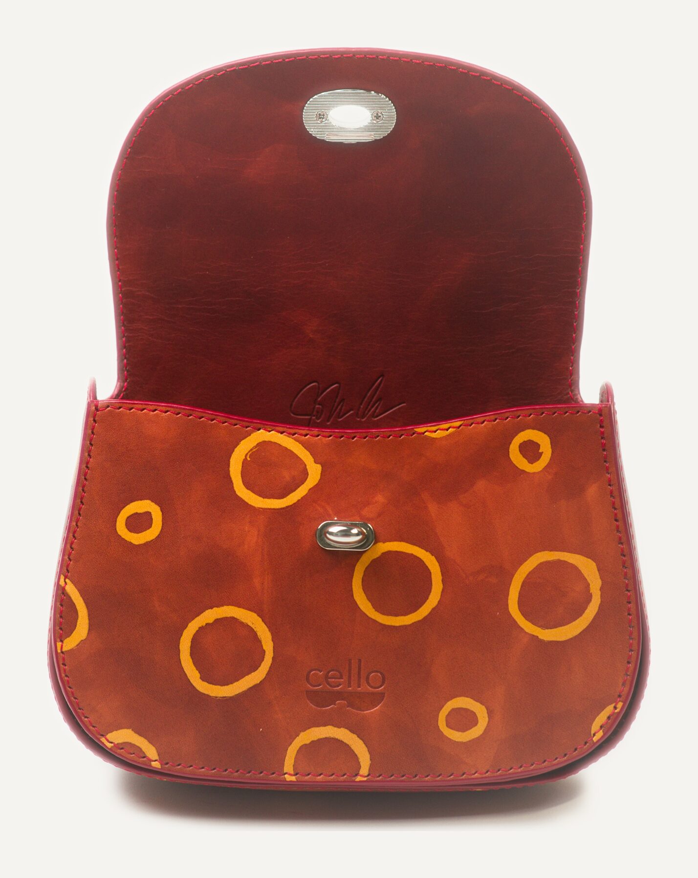 The same bag open, rings continuing across the inside panel
