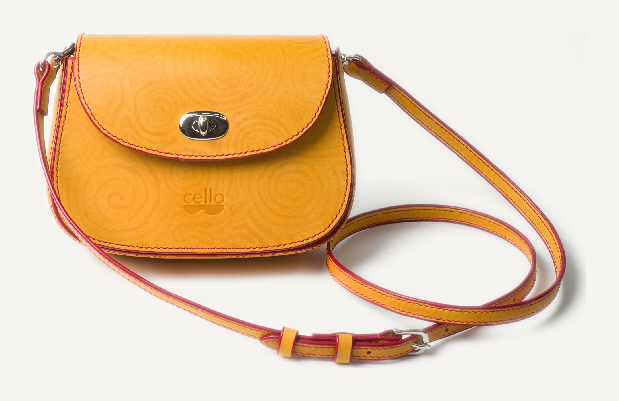 The same bag finished, with its strap, the tone-on-tone swirls visible only up close